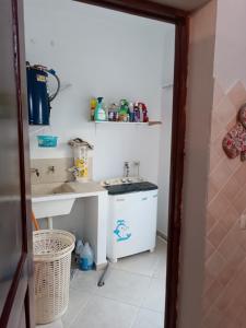 a kitchen with a sink and a washing machine at TropicalHouse in Punta Cana