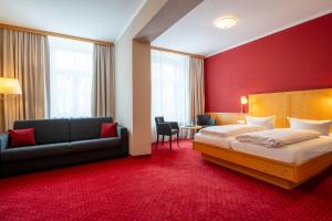 Postel nebo postele na pokoji v ubytování Hotel Vollmann