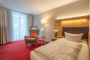 Postel nebo postele na pokoji v ubytování Hotel Vollmann