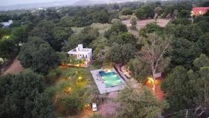 an overhead view of a house with a swimming pool at The chocolate frog in Udaipur +18 photos