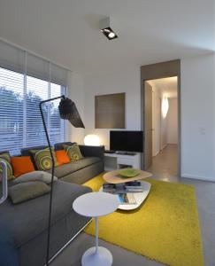 a living room with a couch and a table at Casa Faro Favignana in Favignana