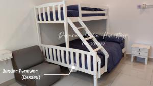 a white bunk bed with a ladder in a room at Desaru Yulin Homestay 雨林客棧Desaru, Bandar Penawar in Bandar Penawar