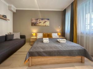 Postel nebo postele na pokoji v ubytování Asbóth Taylor Apartment