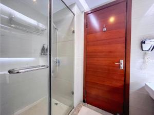 Ein Badezimmer in der Unterkunft 广州沃家国际公寓