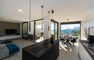 a living room with a couch and a table at Beautiful Apartment In Rovanjska in Rovanjska