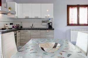 a kitchen with a table with a bowl on it at Sandra House - Certaldo in Certaldo +15 photos