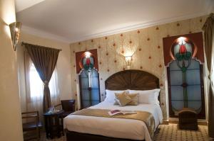 Ένα ή περισσότερα κρεβάτια σε δωμάτιο στο Le Temple Des Arts +49 φωτογραφίες