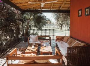 a living room with a couch and a table at Estancia La violeta in Chajarí