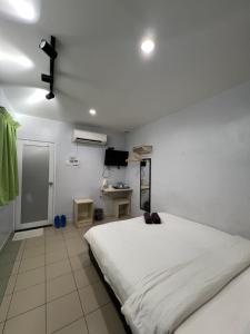 Hotel Seri Kangsar KK Hotel客房内的一张或多张床位