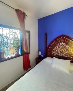 Postel nebo postele na pokoji v ubytování Riad Tassili Chaouen