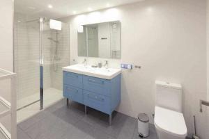 a bathroom with a sink and a toilet and a shower at GuardaViñas24 in Logroño +38 photos