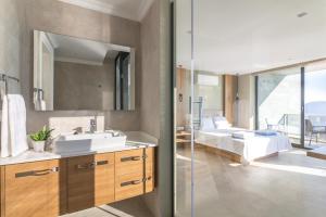 a bathroom with a sink and a mirror at Villa Eliz in Kalkan +13 photos