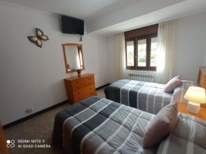 Ένα ή περισσότερα κρεβάτια σε δωμάτιο στο Casa de la abuela