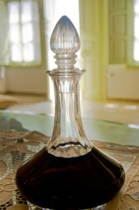 a bottle of wine sitting on a table at Angel Cave Houses in Oia