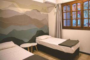 Postel nebo postele na pokoji v ubytování Fuxia House Hostel + 33 fotografií