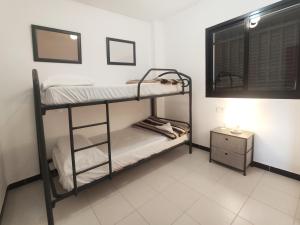Posteľ alebo postele v izbe v ubytovaní Apartamentos Surfing 3000