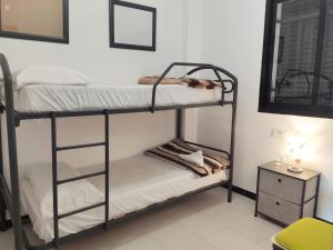Posteľ alebo postele v izbe v ubytovaní Apartamentos Surfing 3000