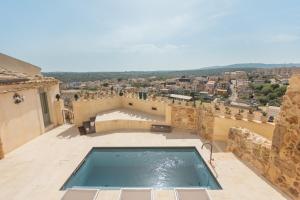 a swimming pool on the roof of a building at Villa Edda in Noto