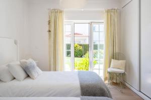 Ένα ή περισσότερα κρεβάτια σε δωμάτιο στο Beautiful villa newly renovated in 2024 on top Portuguese resort +77 φωτογραφίες
