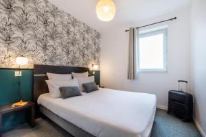 Nemea Appart Hotel Toulouse Aéroport客房内的一张或多张床位