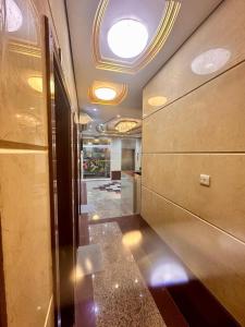a hallway in a building with a ceiling at Galaxy Star Hotel in Dubai