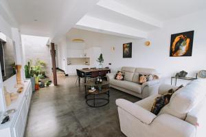 a living room with a couch and a table at Garden House, Playa Honda in Arrecife