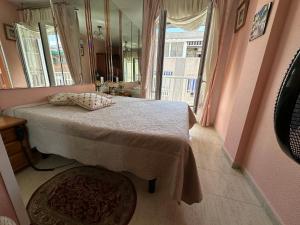 A bed or beds in a room at Apartament Montana