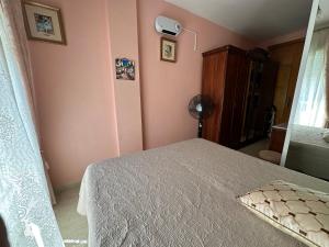 A bed or beds in a room at Apartament Montana
