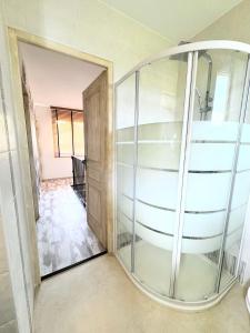 a glass elevator in a room with a hallway at Campo Vecchio Dracena et Piscine in Ghisonaccia +30 photos
