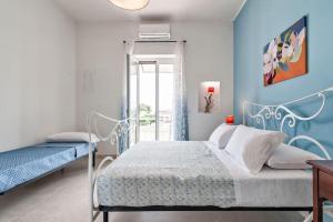 Postel nebo postele na pokoji v ubytování Casa Fiorita Apartment & Free Parking - Lecce Selection