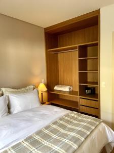 Cama ou camas em um quarto em Zur Suítes