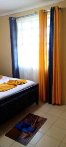 Ένα ή περισσότερα κρεβάτια σε δωμάτιο στο Cosyhomes