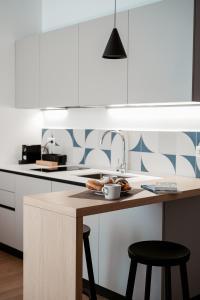 a kitchen with a sink and a counter with some food at Paramar Casa Vacanza Conversano in Conversano +33 photos