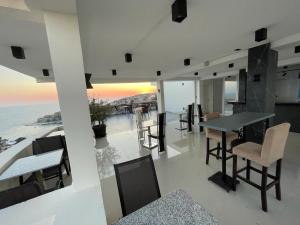 a dining room with a view of the ocean at Molla Apartments in Ulcinj