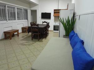 a living room with a couch and a dining room table at CASA CENTRO Avenida Peron in La Rioja