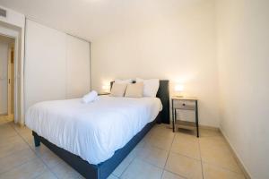 Postel nebo postele na pokoji v ubytování La terrasse d'Ernest T2 recent,Terrasse, Clim, CV