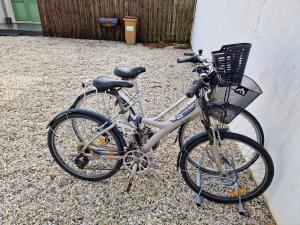 a bike with a basket parked next to a building at le Paradis in La Noue