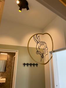 a bathroom with a sign on the wall at Alex Maastricht in Maastricht