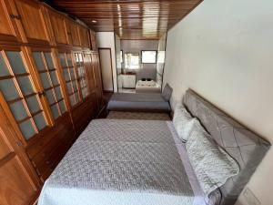 a small room with a bed and a bathroom at Casa de Campo Teresópolis in Teresópolis +13 photos