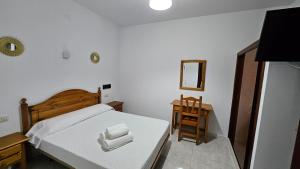 Postel nebo postele na pokoji v ubytování Hotel Nuevo Julios by Olda