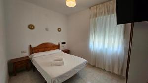 Postel nebo postele na pokoji v ubytování Hotel Nuevo Julios by Olda