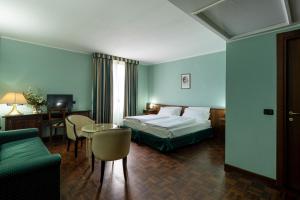 Posteľ alebo postele v izbe v ubytovaní Hotel Lucrezia Borgia