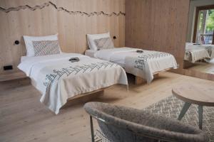 Postel nebo postele na pokoji v ubytování Hotel Bohinj