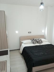Postel nebo postele na pokoji v ubytování Palazzo Lembo