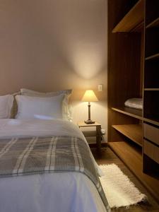 Cama ou camas em um quarto em Zur Suítes
