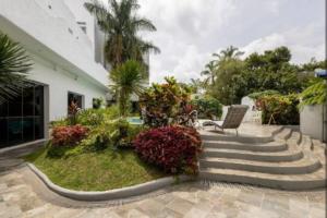 a garden with stairs and plants in front of a building at Studio Unit at La Bella Tagaytay Residences in Tagaytay