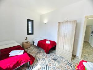 Postel nebo postele na pokoji v ubytování Magaggiari Reef