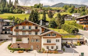 an aerial view of a hotel in a village at Appartements Landhaus Hubertus Wellness & Breakfast in Schladming