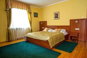 Postel nebo postele na pokoji v ubytování Hotel Adalbertus