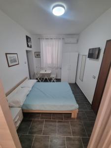 Postel nebo postele na pokoji v ubytování Piazza Salotto + 6 fotografií